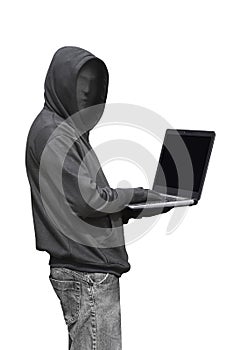 Hooded man with mask typing on laptop