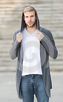 Hooded outfit. Handsome man stylish hairstyle. Handsome caucasian man gray background. Ideal traits that make man