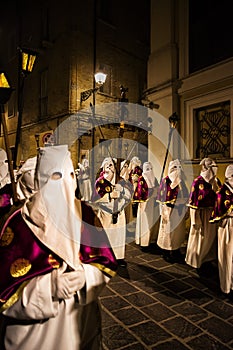 Hooded penitents during the famous Good Friday procession in Chieti (Italy) with the luminous lantern