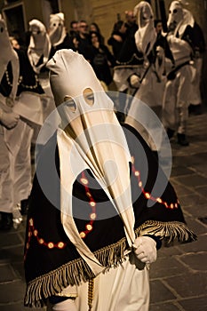Hooded penitents during the famous Good Friday procession in Chieti (Italy) with their hoods pulled