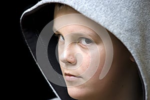 Hooded teenage boy