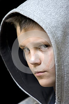 Hooded teenage boy