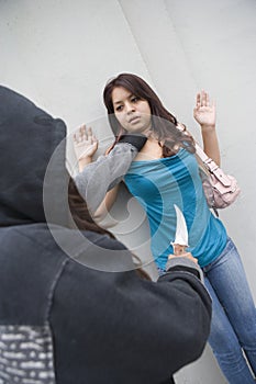 Hooded Woman Robbing Young Woman With Knife