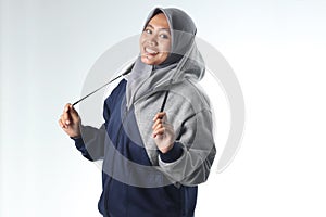 Hooded woman wearing gray jacket  on white background