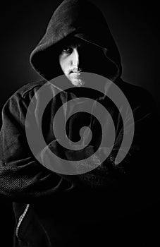 Hooded Youth against Dark Background