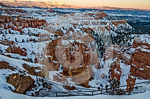 Hoodoos and Fir Trees Covered with Snow in Utah