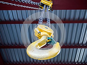 Hook of a hand loader under the ceiling of a building