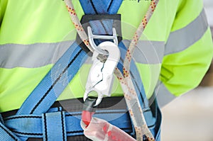 Hook of the safety carabiner attached to the safety belt is worn on the worker