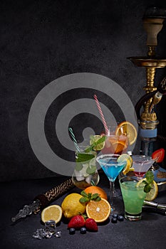 Hookah shisha and cocktails set on dark grey background. Hookah bar, cocktail bar. Party