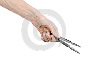 Hookah topic: Bartender holding a hookah coal tongs isolated on a white background