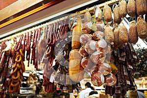 Hooks, butcher and dry meat in shop for traditional food, groceries or products in Germany. Supermarket, deli and