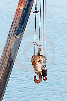 Hooks and cables of crane for hoisting heavy loads photo