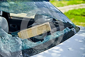 Hooligans broken car rear window, trouble on the road