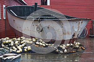 Hoonah, Alaska: A rusty fishing boat and various fishing nets photo