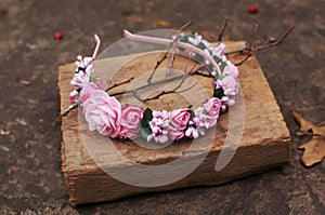 Hoop from flowers, wreath with colored flowers. Handmade flowers wreath on outdoor metal stand. Accessory. Artificial flowers, ha