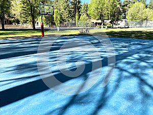 hoop net school playground basketball court park shadows afternoon sunshine sports ground floor