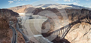 The Hoover Dam with a shadow of the nearby bridge