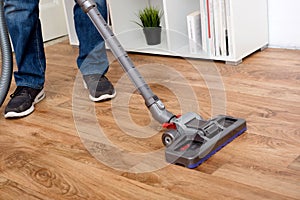 Hoovering a parquet floor wooden