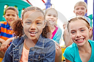 Hope for the future. A multi-ethnic group of happy children playing on a jungle gym in a play park.