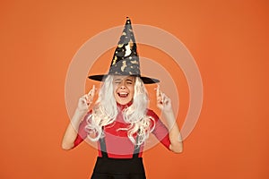 Hope spell works. Little child in witch costume. Halloween party. Small girl in black witch hat. Autumn holiday. Join