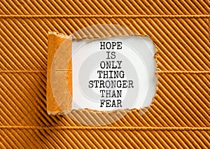 Hope stronger than fear symbol. Concept words Hope is the only thing stronger than fear on beautiful white paper on a beautiful