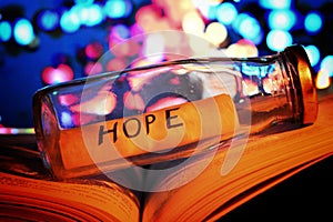 Hope under the bottle with bokeh light backgroundback