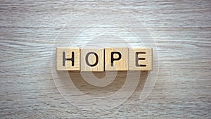 Hope word made of cubes, pure and genuine belief in god, prayers and blessings