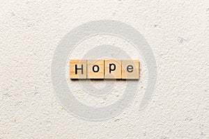 hope word written on wood block. hope text on table, concept