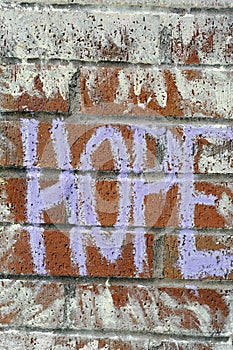 Hope written on brick wall with chalk