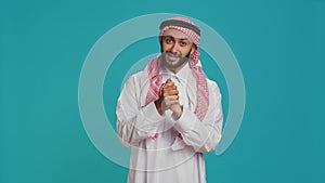 Hopeful arab man begging