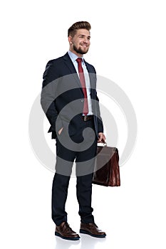 Hopeful businessman holding his hand in his pocket