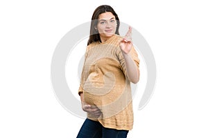 Hopeful future mother making good luck gesture