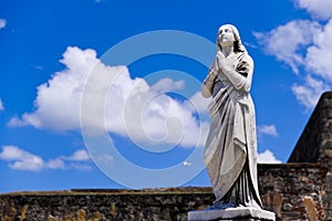 Hopeful Statue of Young Woman Praying