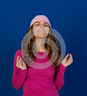 Hopeful woman wearing a pink scarf