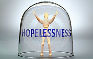 Hopelessness can separate a person from the world and lock in an isolation that limits - pictured as a human figure locked inside
