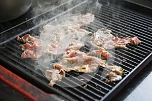 Hopped meat being grilled on the grilling pan
