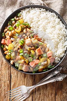 Hoppin john black eyed peas, sometimes called Carolina Peas and Rice, cooked with bacon, sausage, and veggies, and served over
