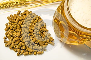 Hops pellets with beer glass photo