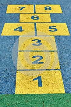 Hopscotch game in perspective in a schoolyard on an asphalt floor