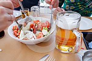 Horiatiki greek salad and beer.
