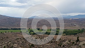 Horizon with fields and mountains