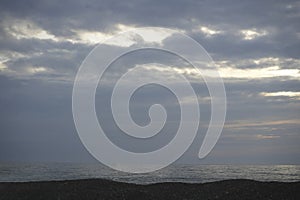 horizon line over Black sea water. sea sky sunset sun landscape. Dramatic heaven during sunset