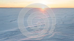 Horizon over frozen sea at sunset