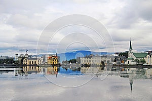 The horizon reflect in the lake of the Reykjavik city, capital of Iceland