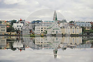 The horizon reflect in the lake of the Reykjavik city, capital of Iceland