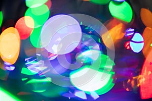 Horizontal abstract bokeh background of evening party circle festive lights in red, yellow, blue, violet, orange round