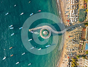 Horizontal aerial view of Los Muertos Pier and hotels at sunset in Puerto Vallarta Mexico