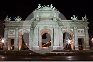 Horizontal AlcalÃ¡ Gate at night