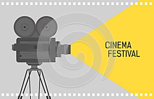Horizontal background for cinema festival with retro camera or movie projector standing on tripod and film perforation