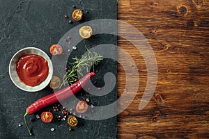 Horizontal background with spices and tomato